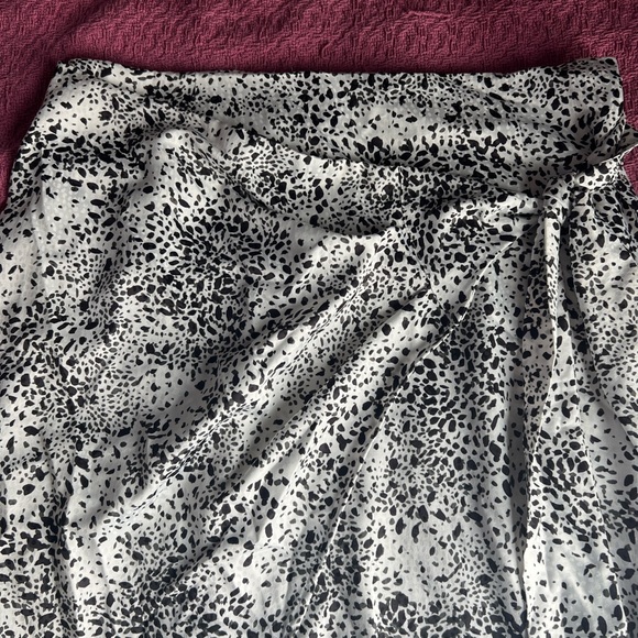 Black and white animal print midi skirt with a satin ish feel to it. - Picture 2 of 5